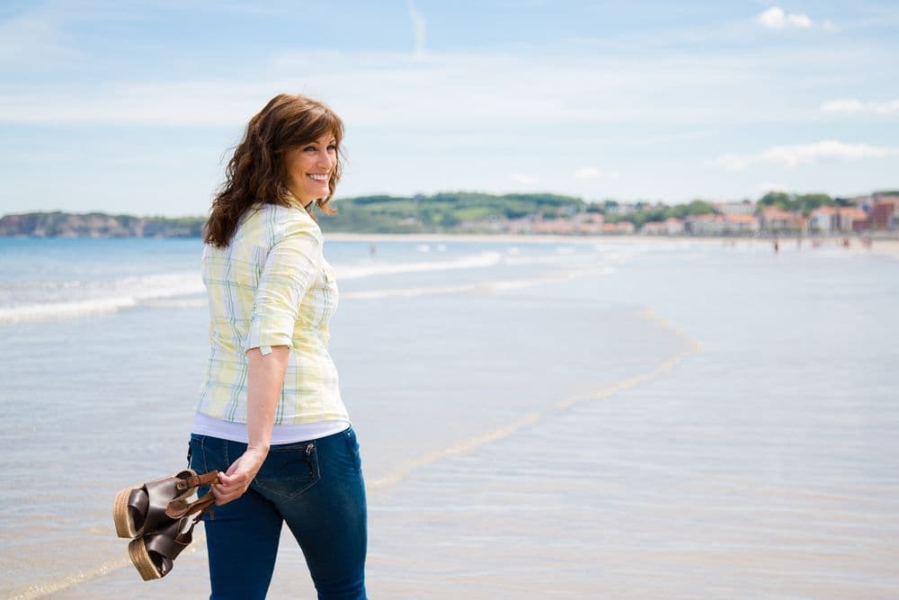 Middle aged woman on a beach